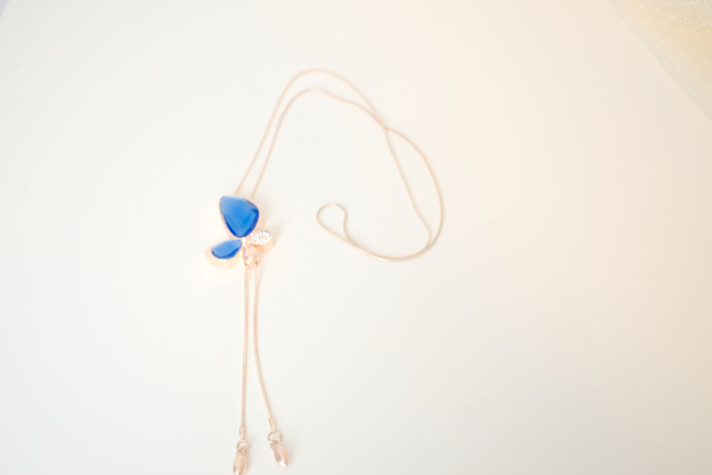 Blue crystal butterfly pendant on Rose Gold chain