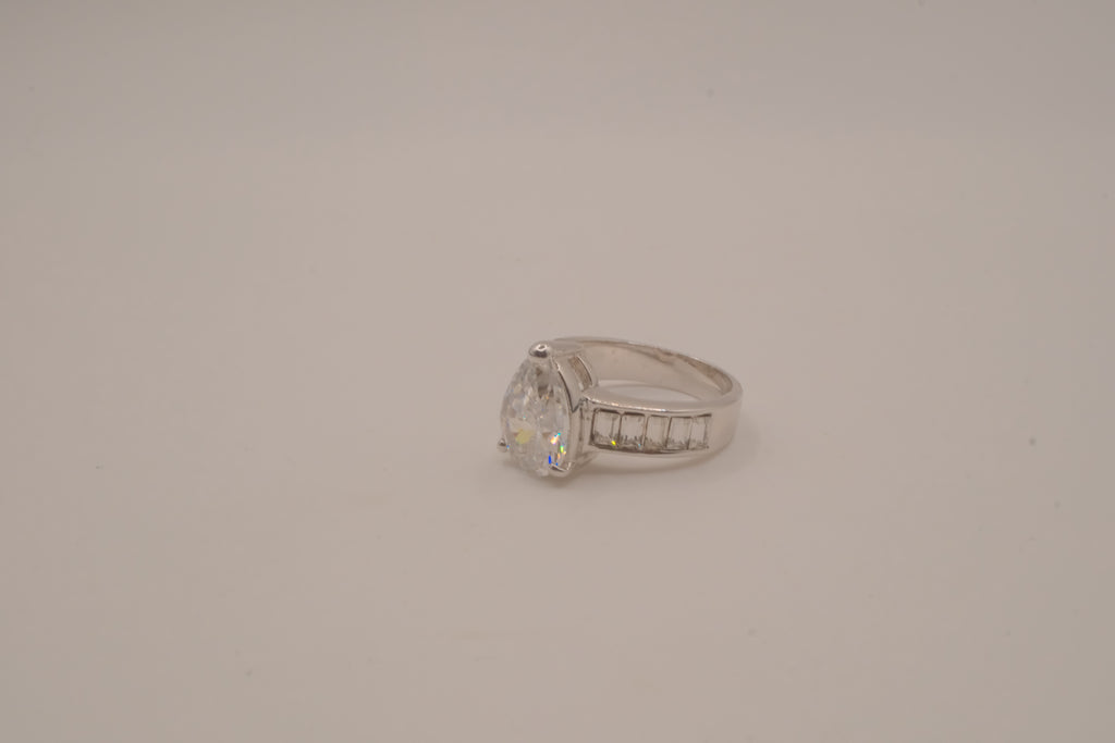 Silver tone pear-cut solitaire ring