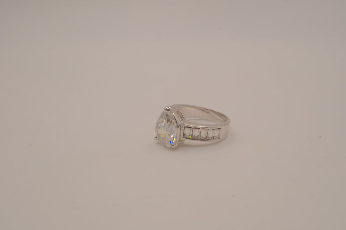Silver tone pear-cut solitaire ring