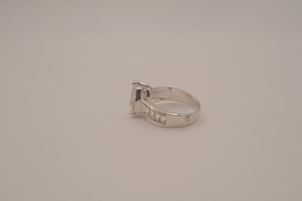 Silver tone pear-cut solitaire ring