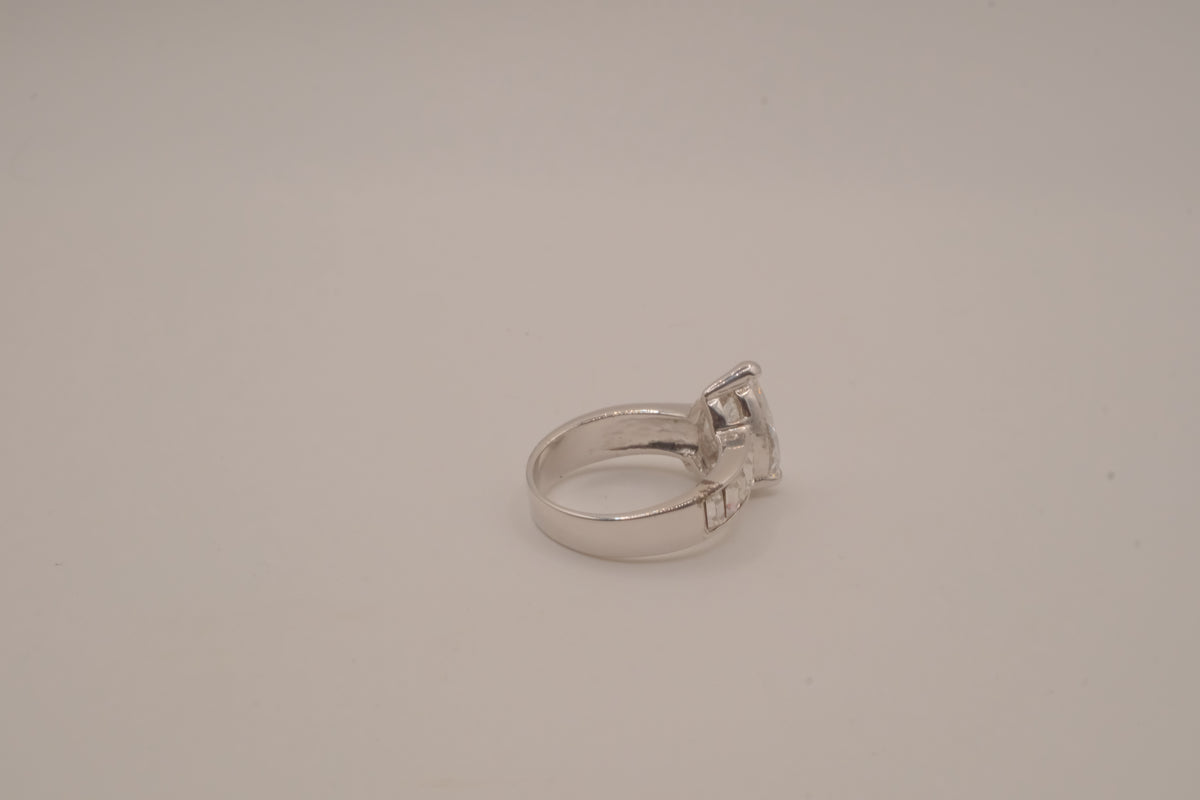 Silver tone pear-cut solitaire ring