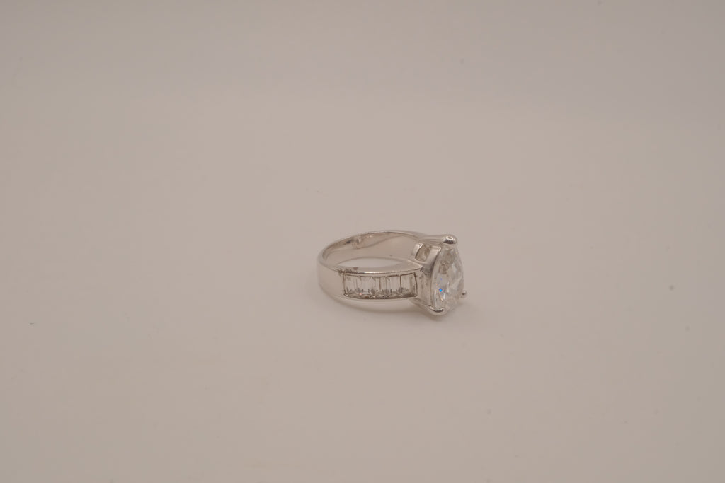 Silver tone pear-cut solitaire ring