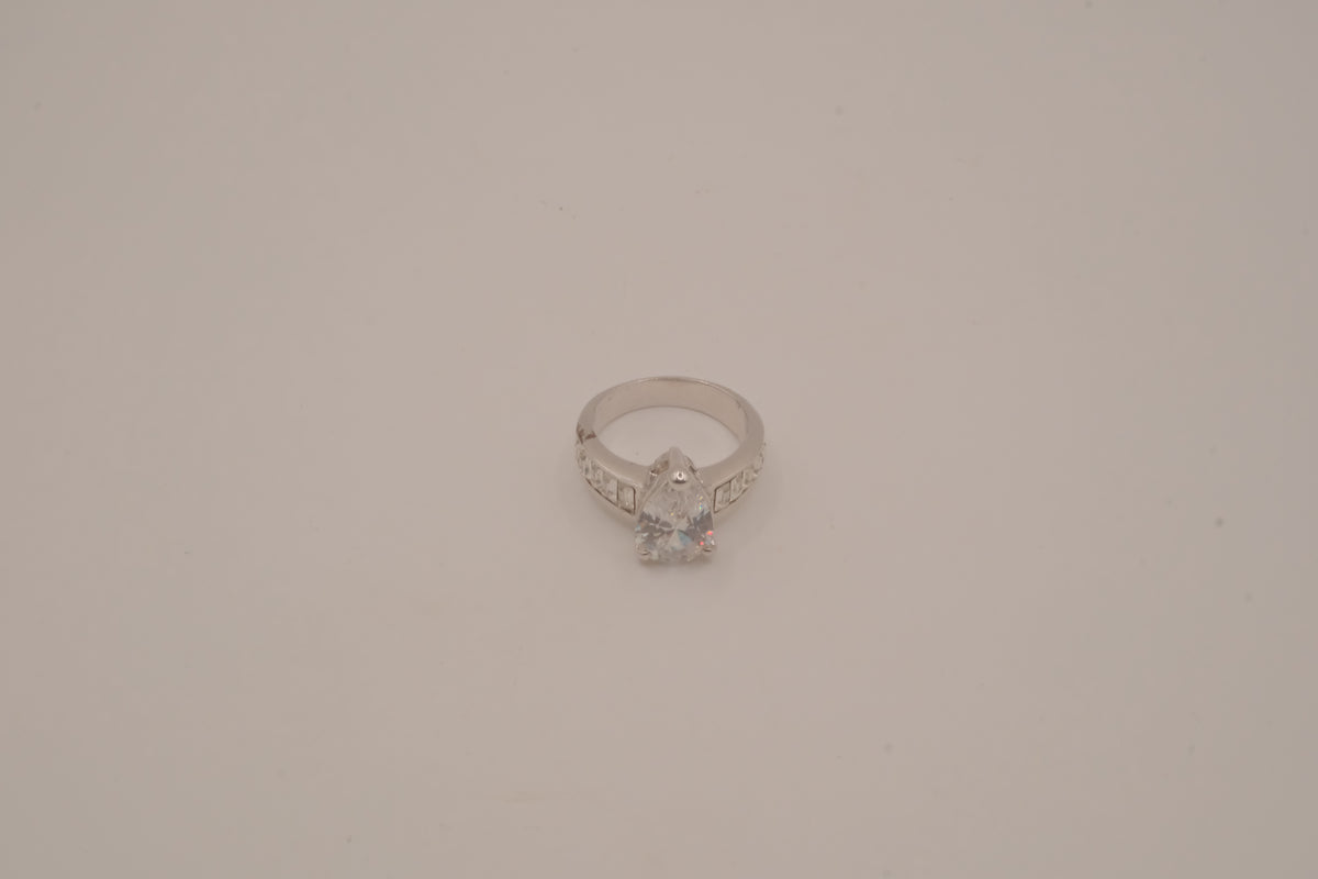 Silver tone pear-cut solitaire ring