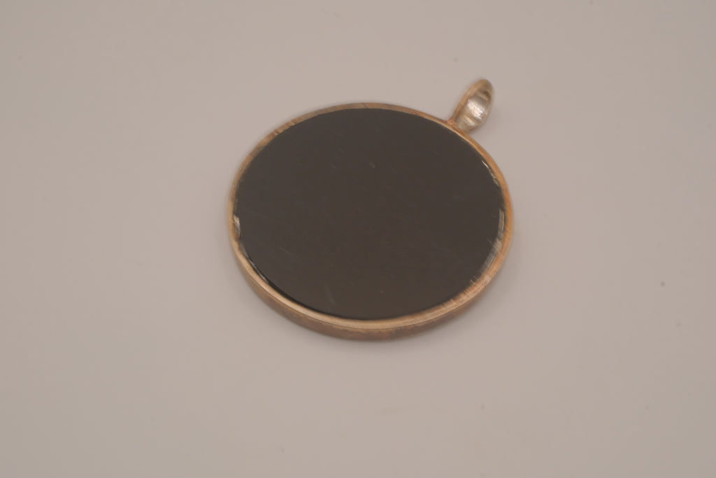 Vintage bronze-tone round pendant