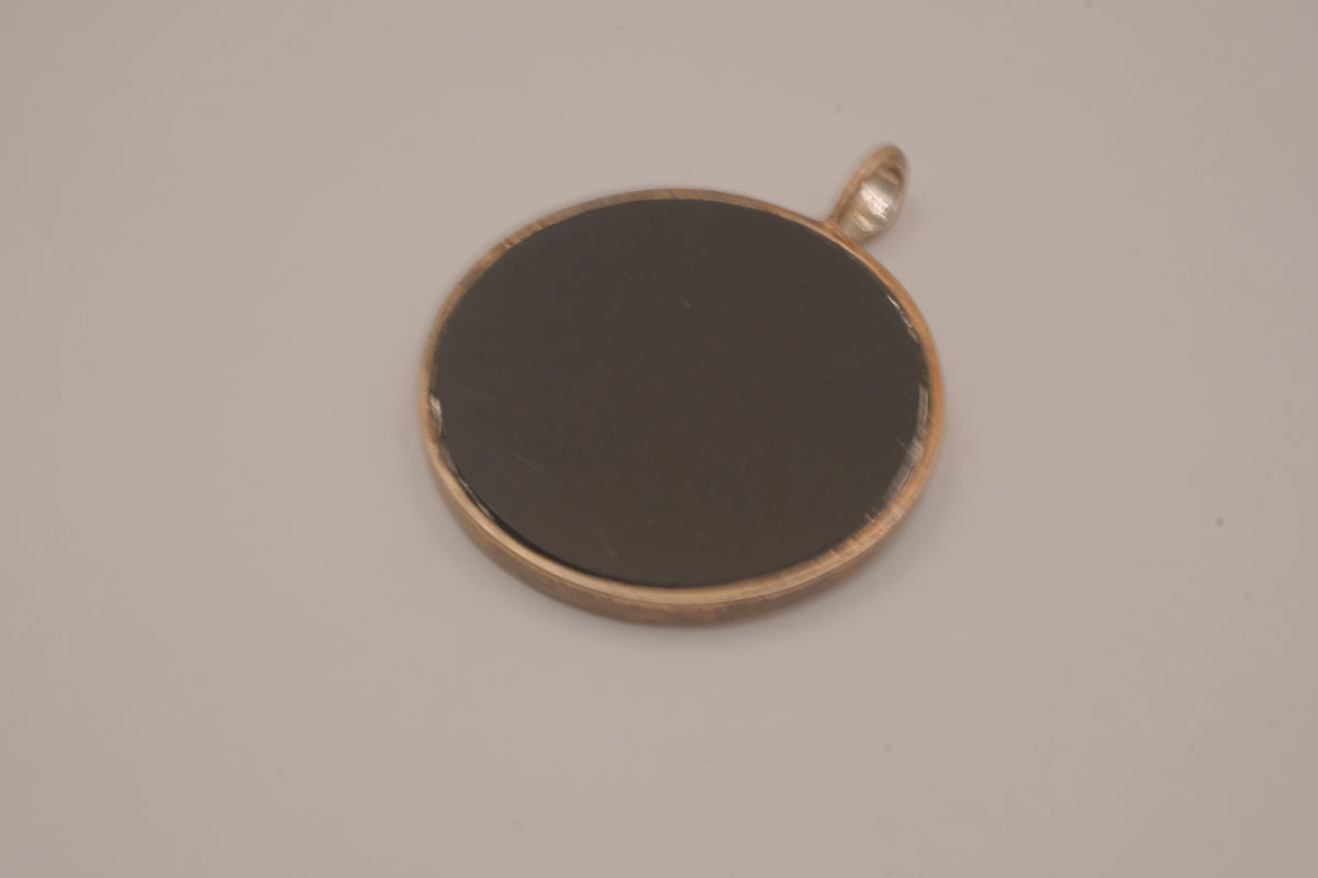 Vintage bronze-tone round pendant