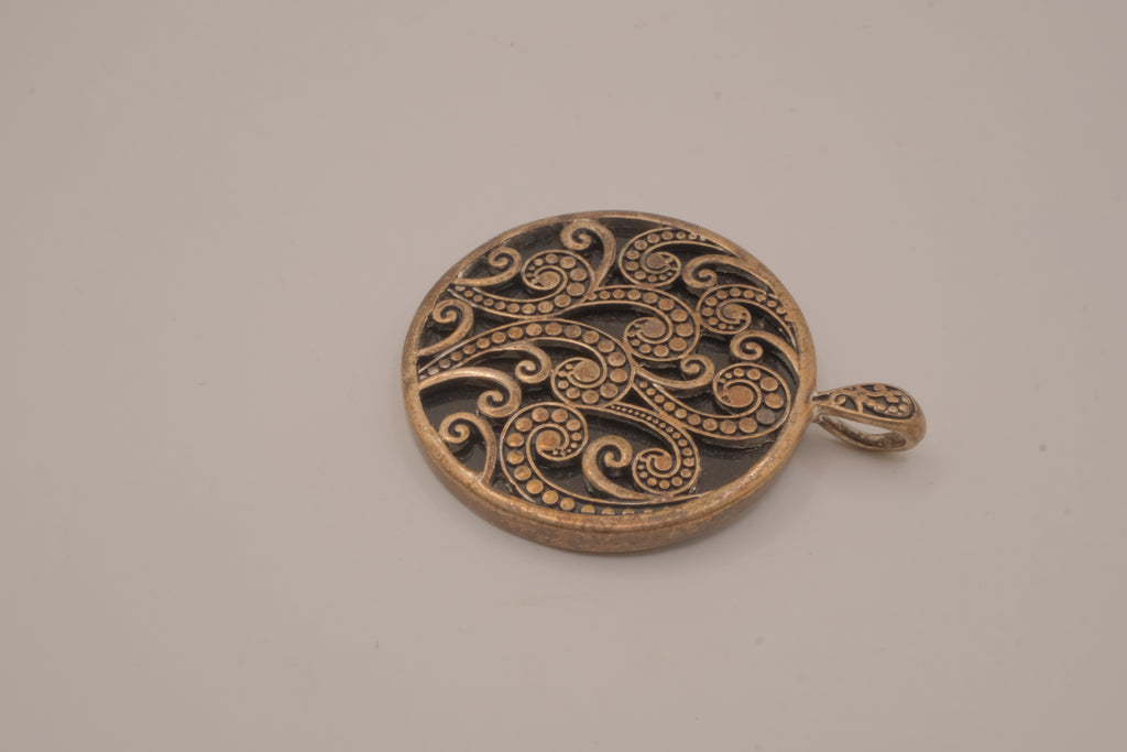 Vintage bronze-tone round pendant