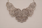 Antique-inspired, silver-toned filigree bib necklace