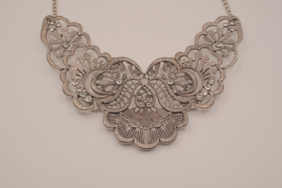 Antique-inspired, silver-toned filigree bib necklace