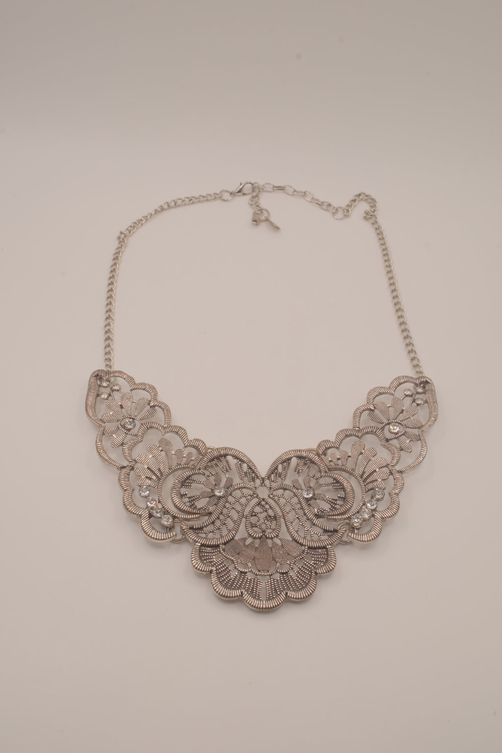Antique-inspired, silver-toned filigree bib necklace