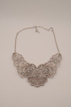 Antique-inspired, silver-toned filigree bib necklace