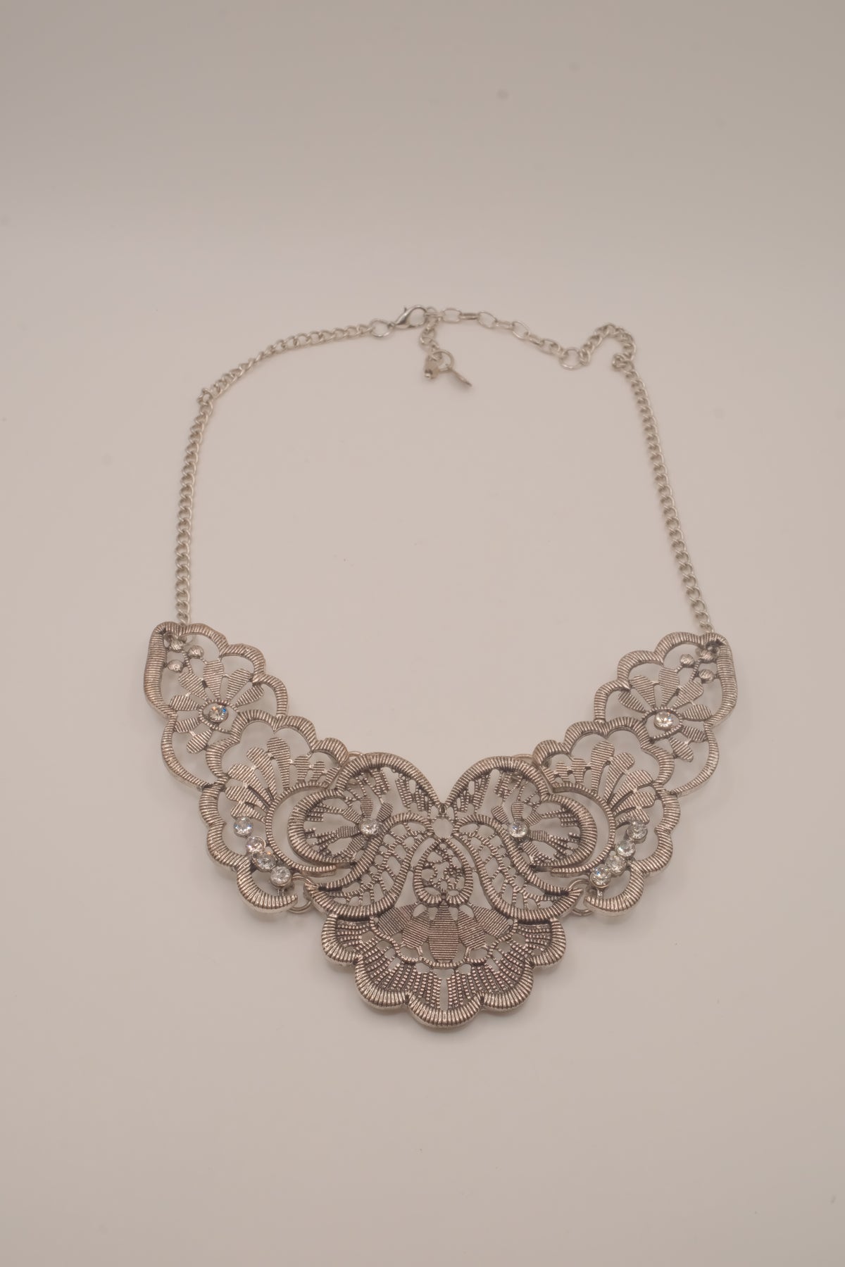 Antique-inspired, silver-toned filigree bib necklace