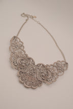 Antique-inspired, silver-toned filigree bib necklace