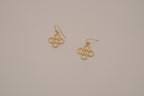 Gold tone interlocking clover drop earrings