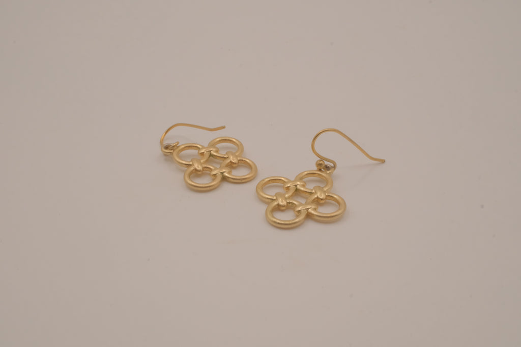Gold tone interlocking clover drop earrings