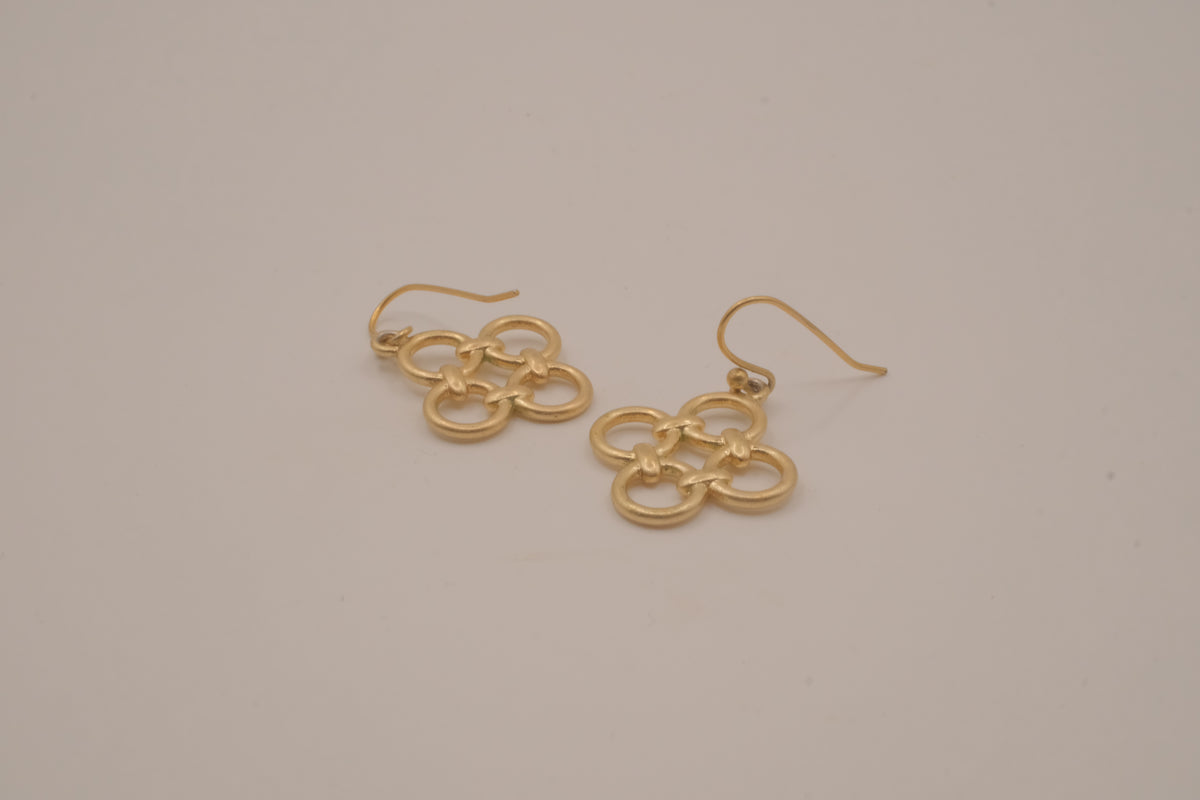 Gold tone interlocking clover drop earrings