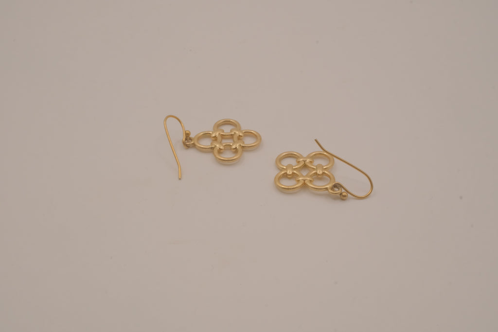 Gold tone interlocking clover drop earrings