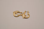 Vintage yellow gold dolphin hoop earring
