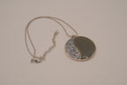 Vintage silver-tone abstract round pendant necklace