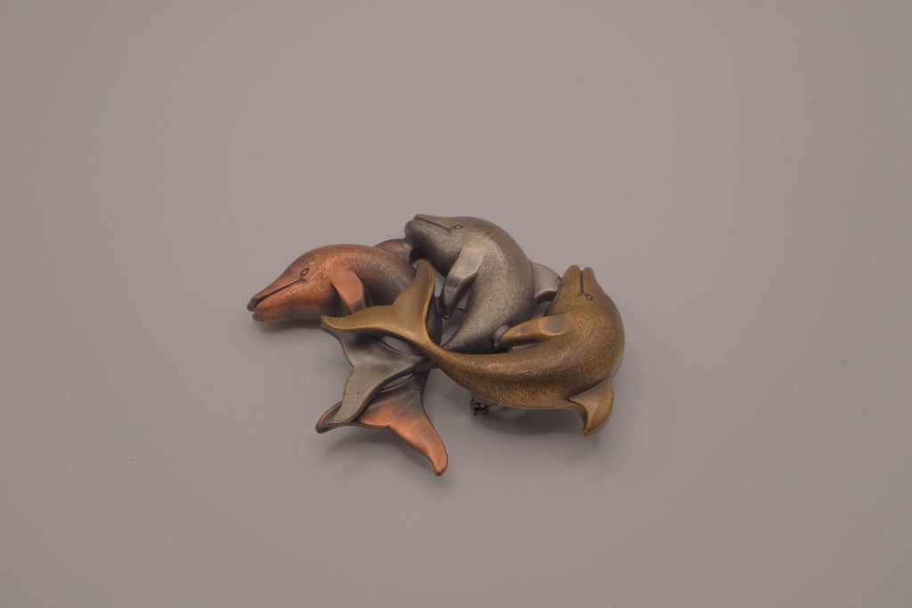 Vintage mixed-metal dolphin family brooch