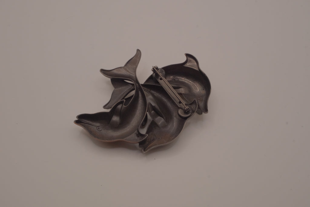 Vintage mixed-metal dolphin family brooch