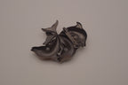 Vintage mixed-metal dolphin family brooch