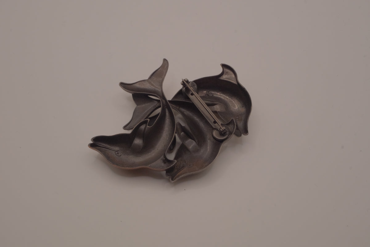 Vintage mixed-metal dolphin family brooch