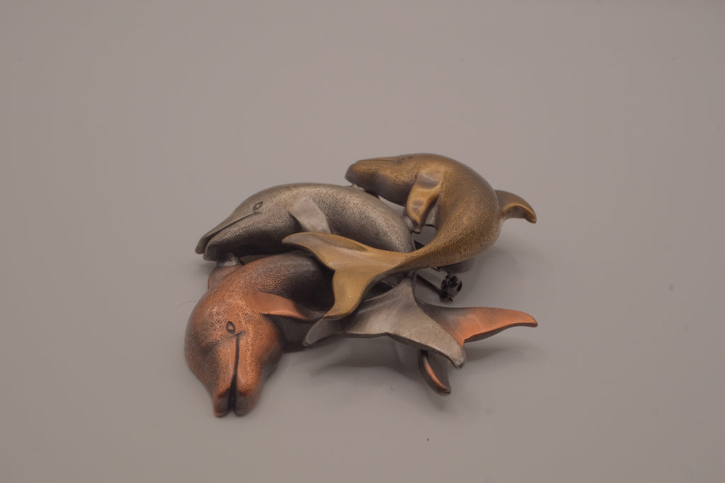 Vintage mixed-metal dolphin family brooch