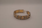 Vintage two-tone Dolphin panel story bracelet
