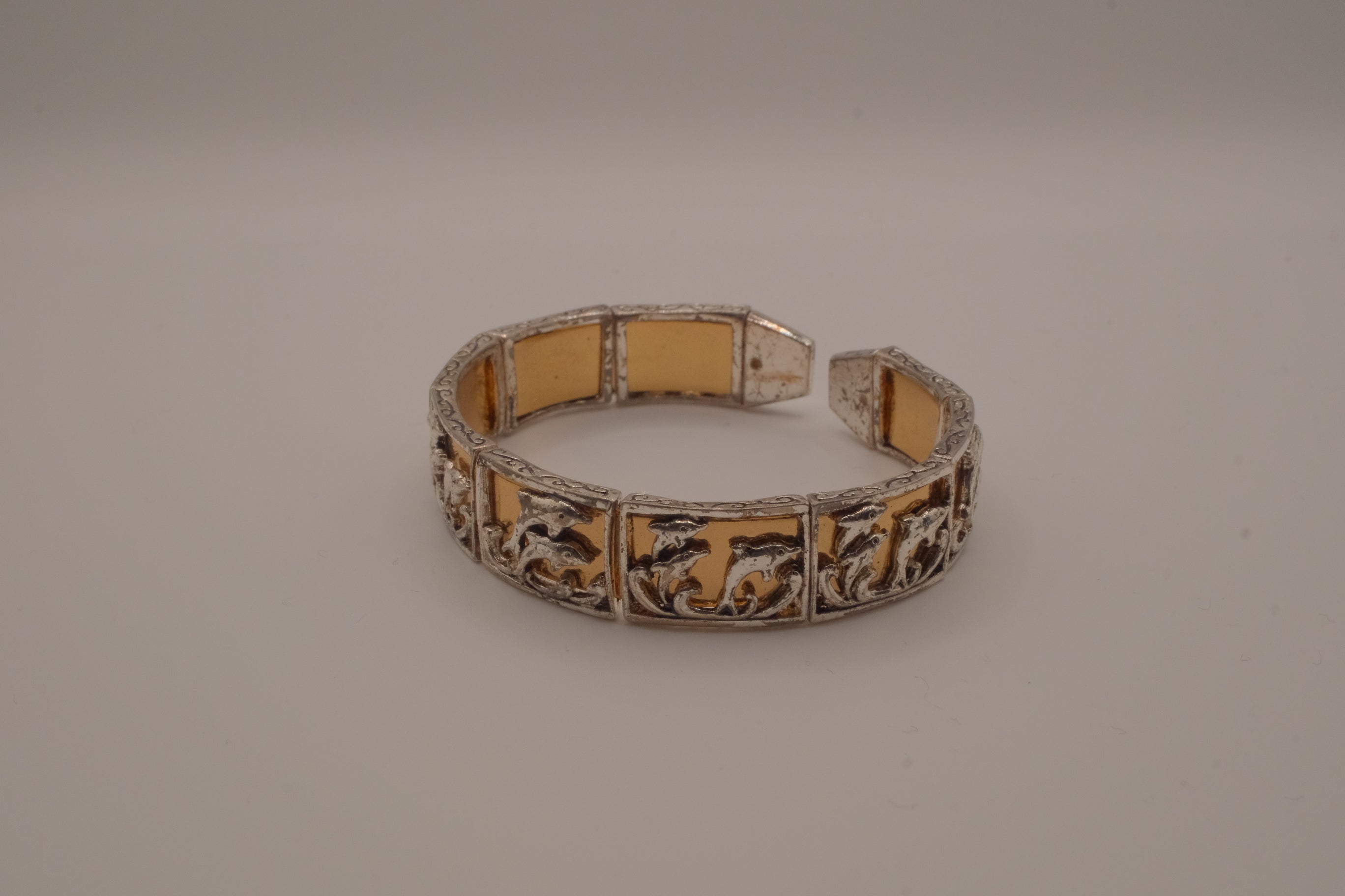 Vintage two-tone Dolphin panel story bracelet