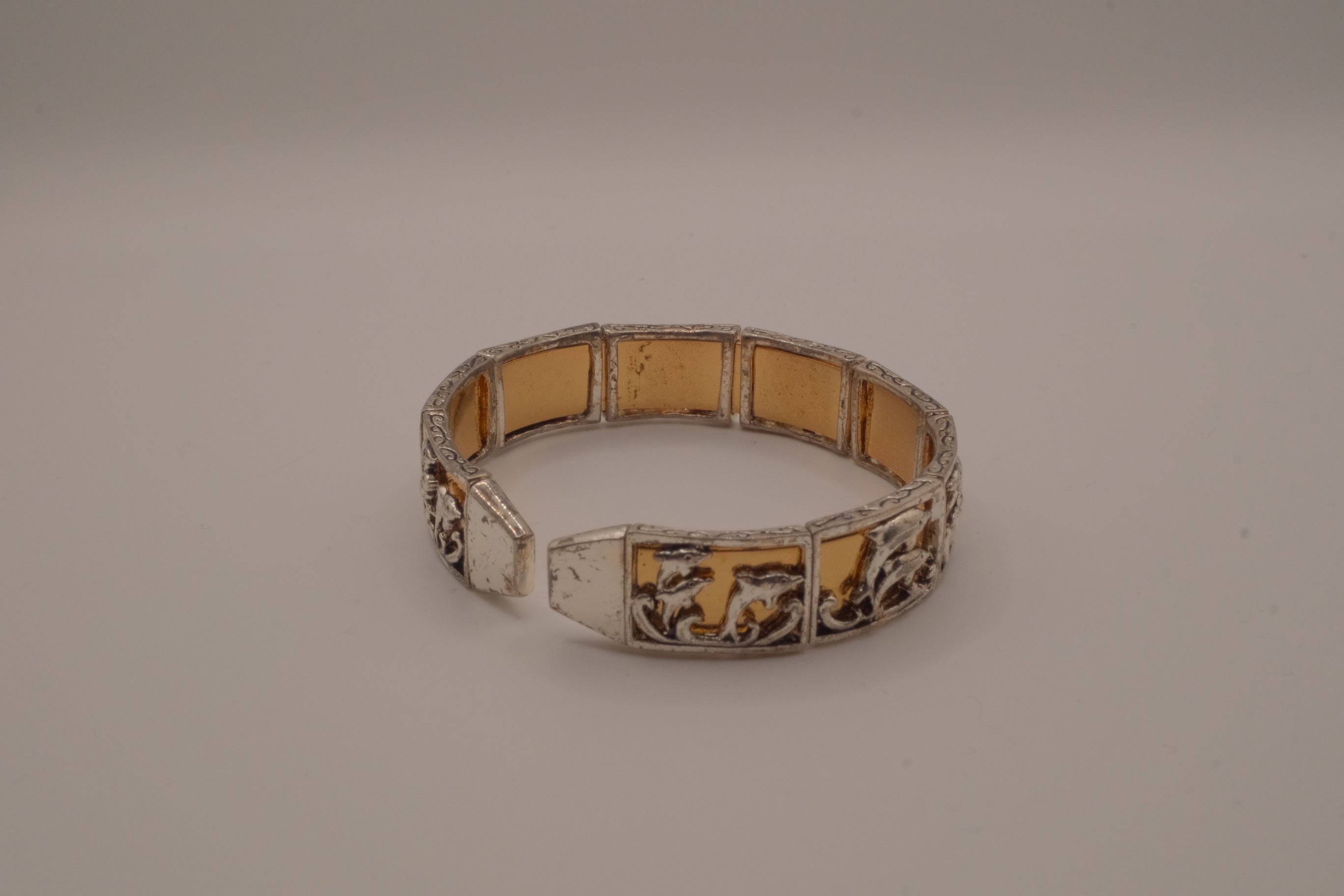 Vintage two-tone Dolphin panel story bracelet