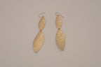 Hammered gold tone double-leaf dangle earrings