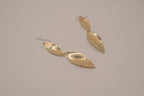 Hammered gold tone double-leaf dangle earrings