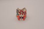 Whimsical, wide-band garden cocktail ring