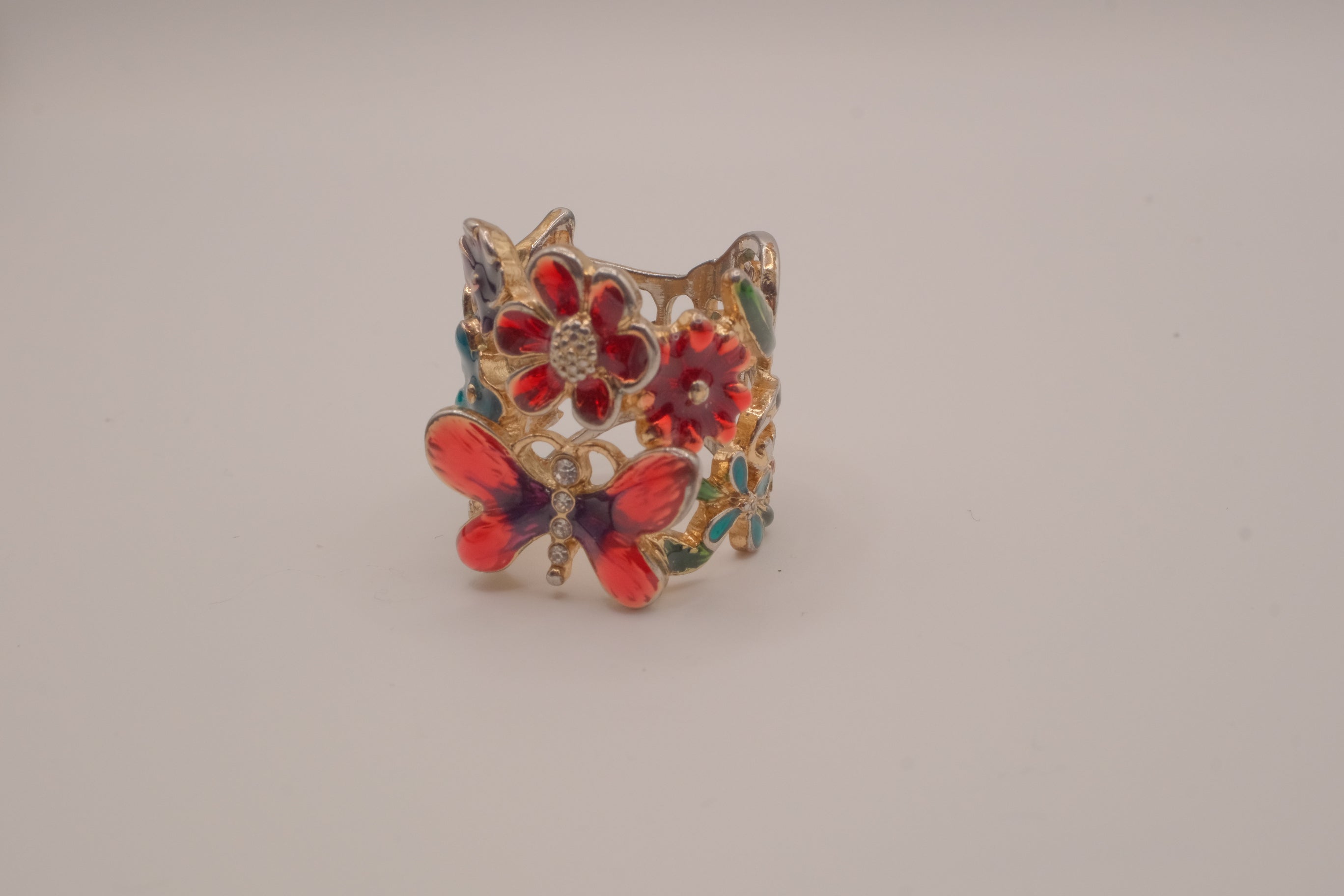 Whimsical, wide-band garden cocktail ring