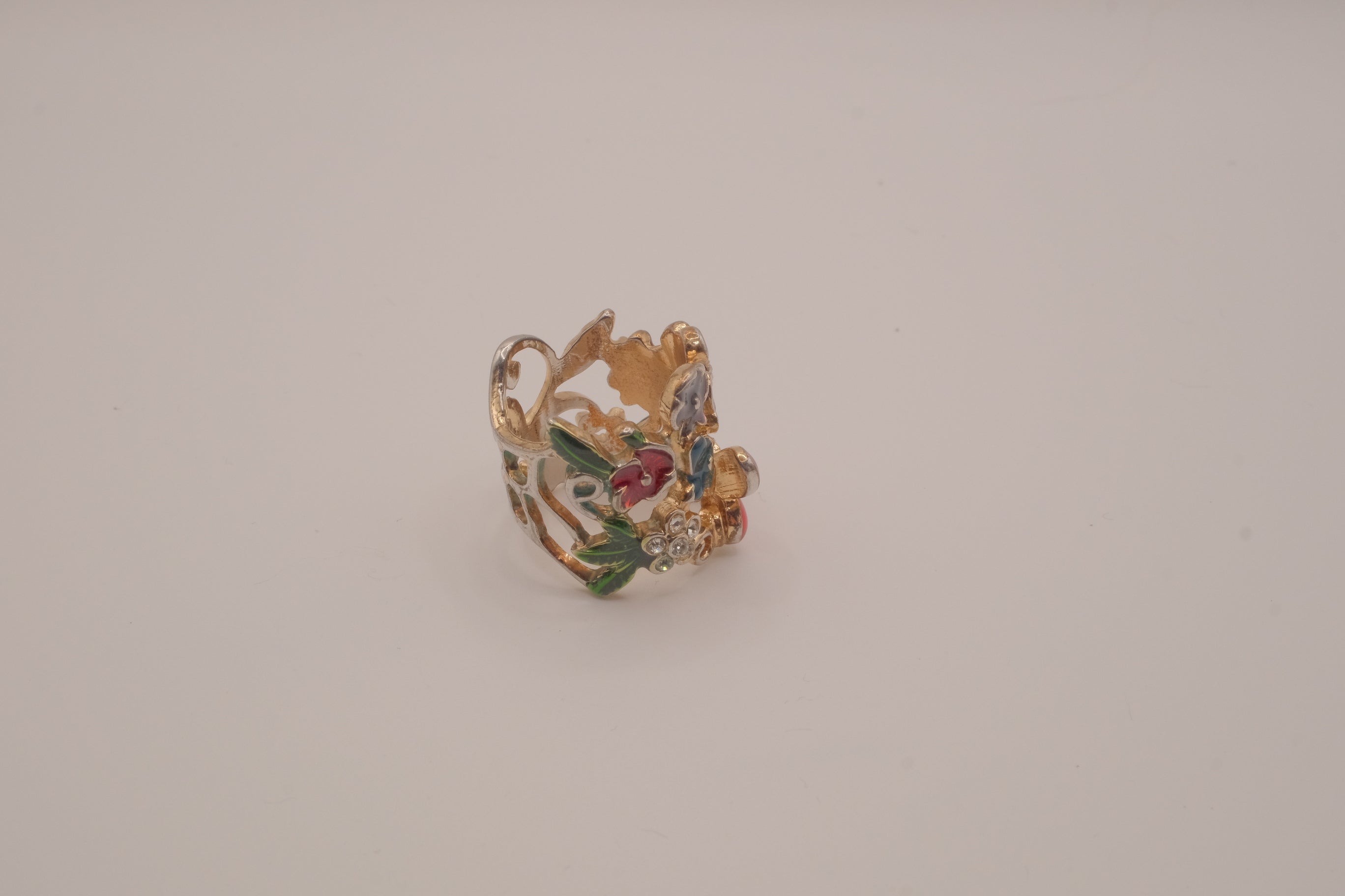 Whimsical, wide-band garden cocktail ring