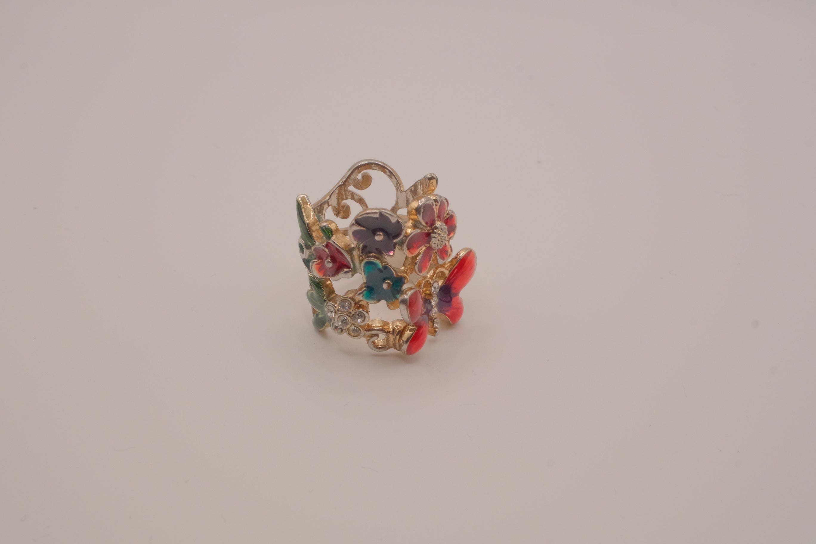 Whimsical, wide-band garden cocktail ring