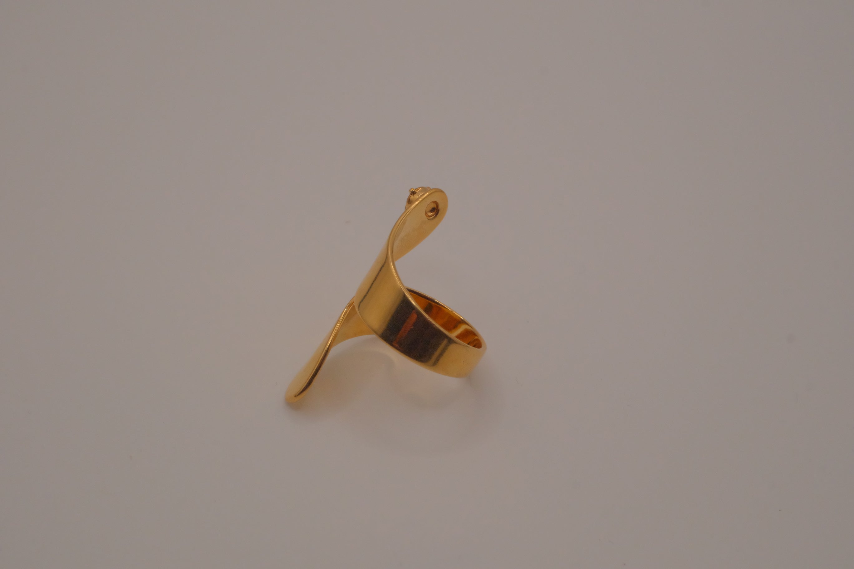 Adjustable gold wrap-around statement ring