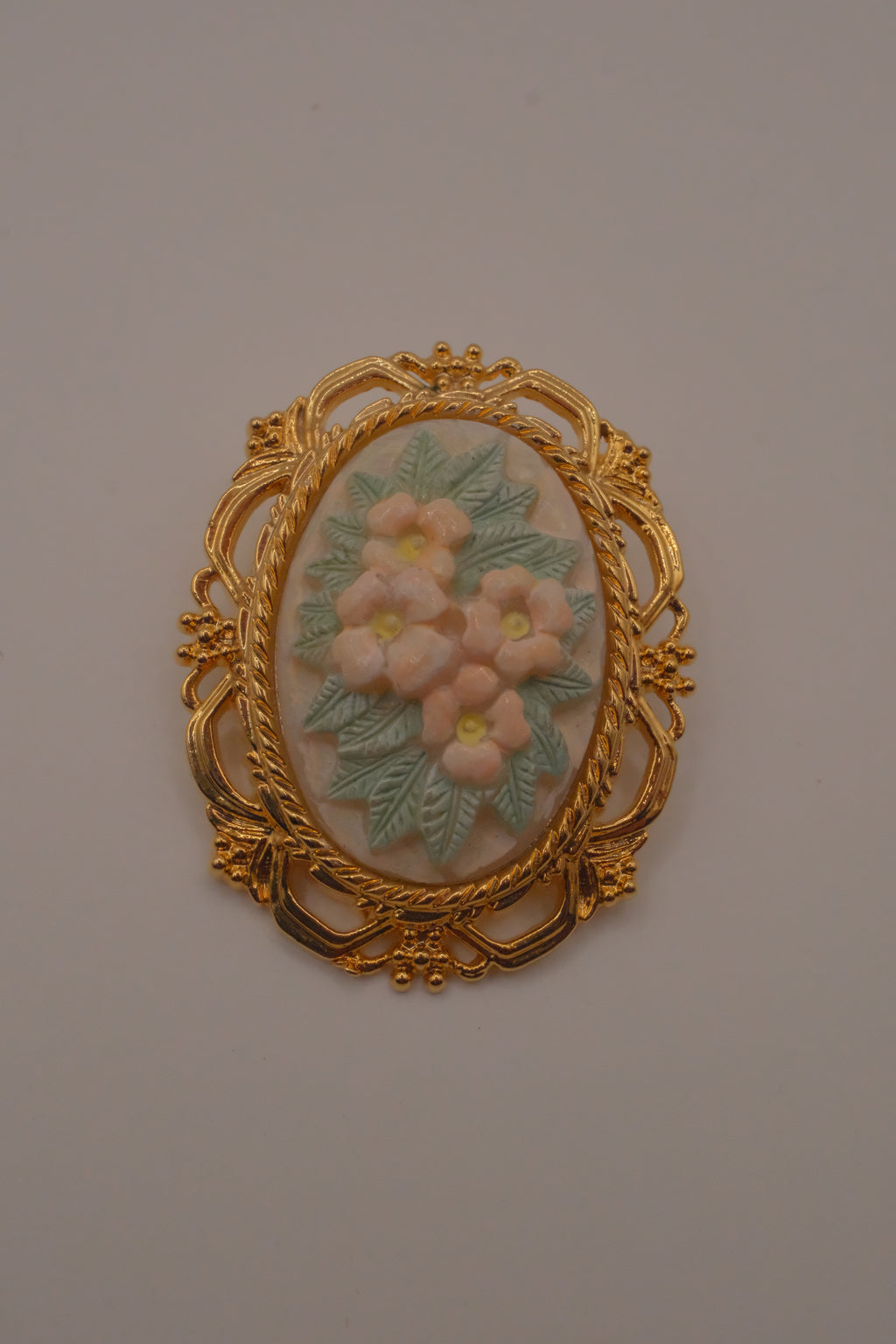 Vintage porcelain floral cameo brooch