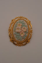 Vintage porcelain floral cameo brooch