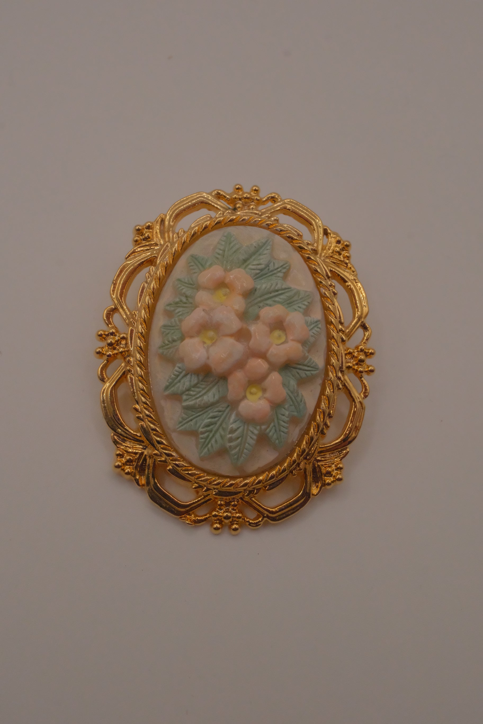 Vintage porcelain floral cameo brooch