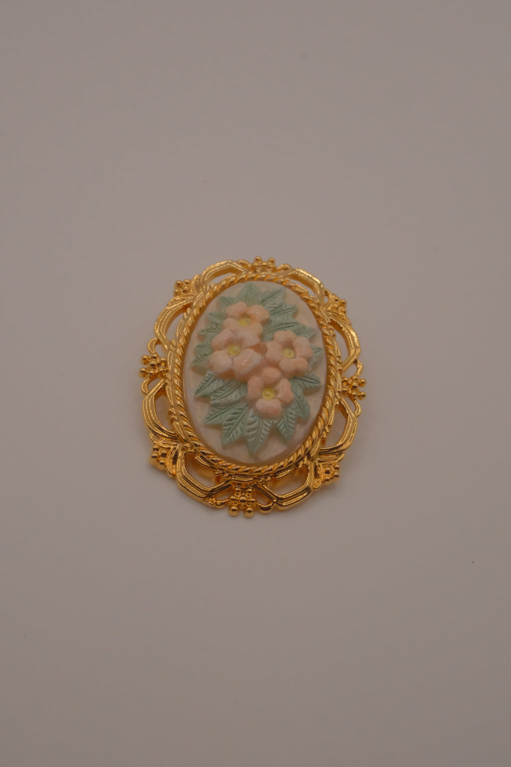 Vintage porcelain floral cameo brooch