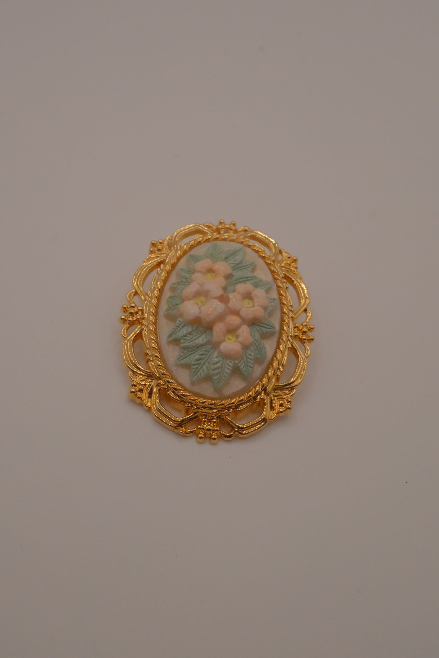 Vintage porcelain floral cameo brooch