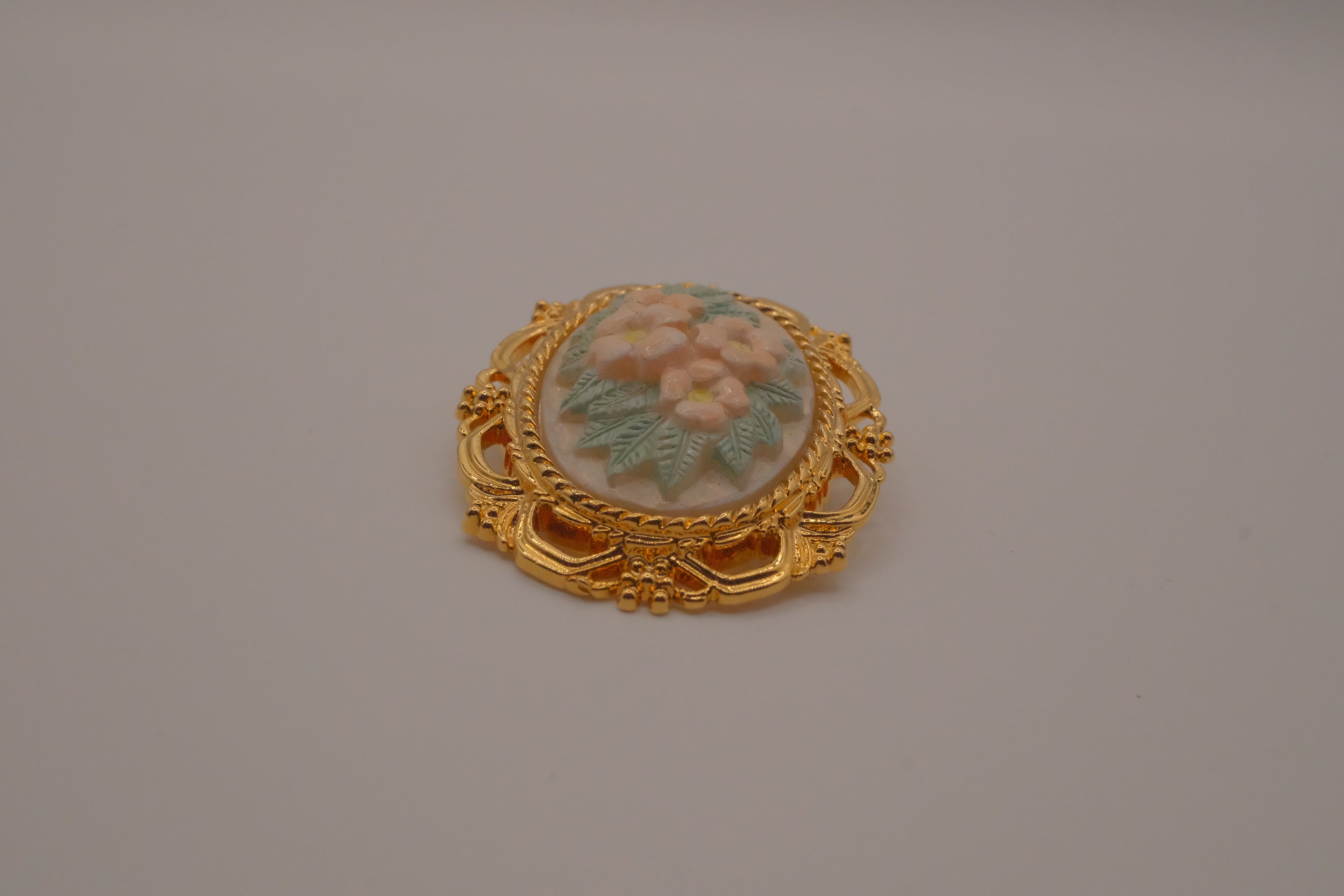 Vintage porcelain floral cameo brooch