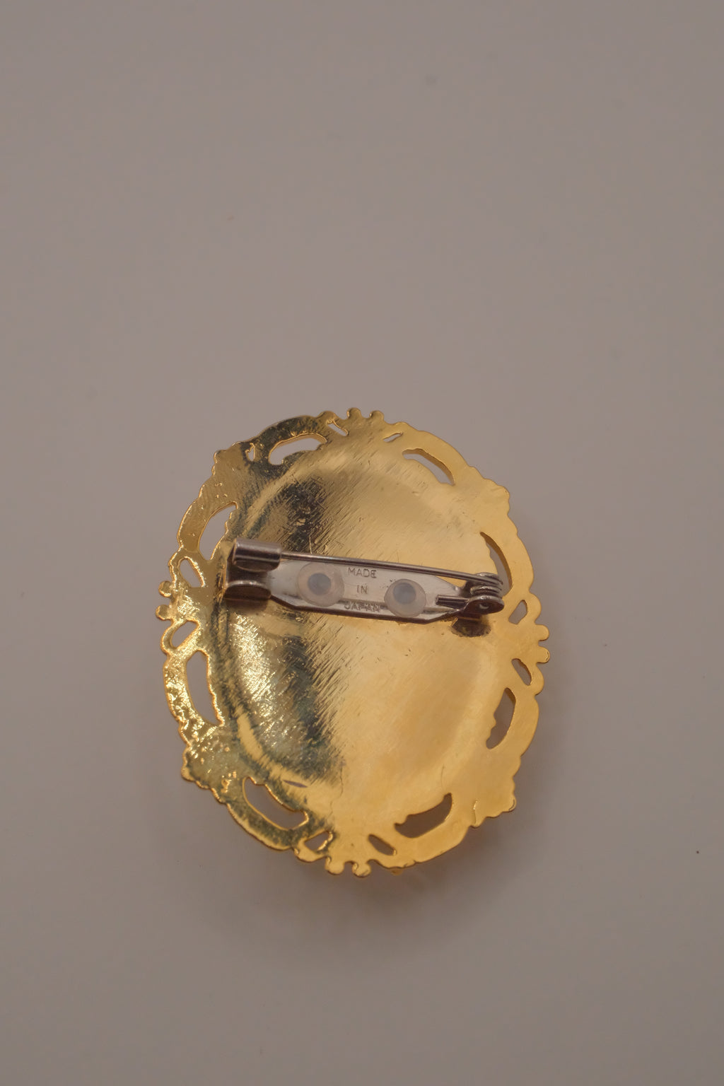 Vintage porcelain floral cameo brooch