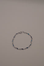 Dainty dolphin-link charm bracelet with Abalone inlay