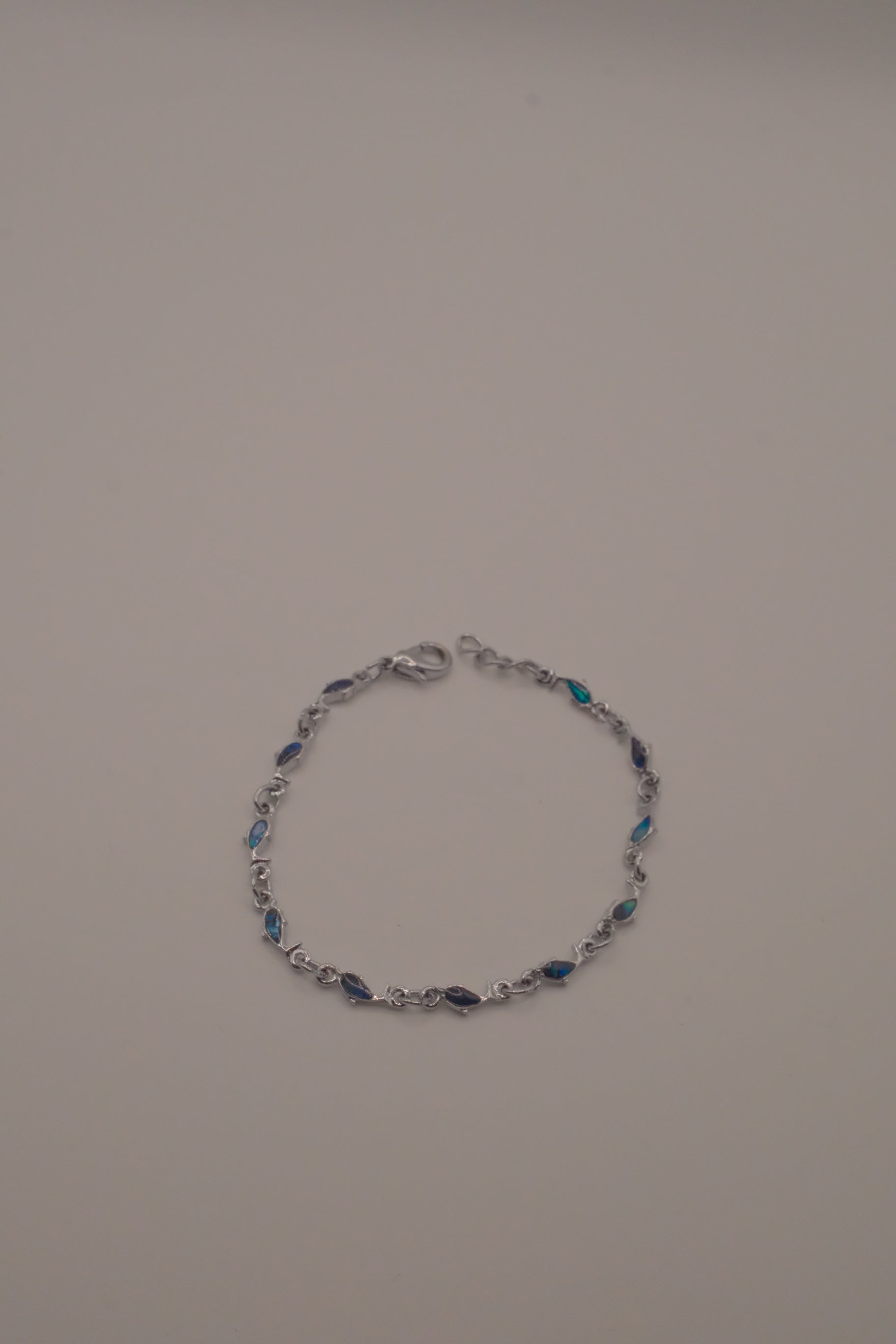 Dainty dolphin-link charm bracelet with Abalone inlay