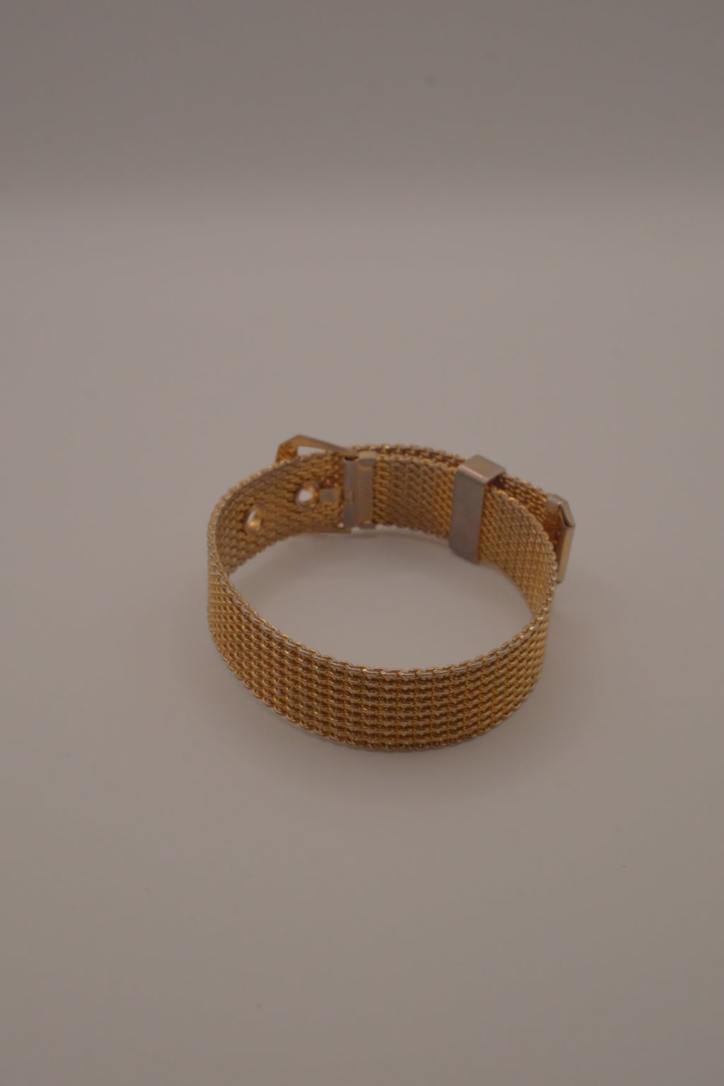 Vintage 1970s Avon gold-tone mesh belt buckle bracelet