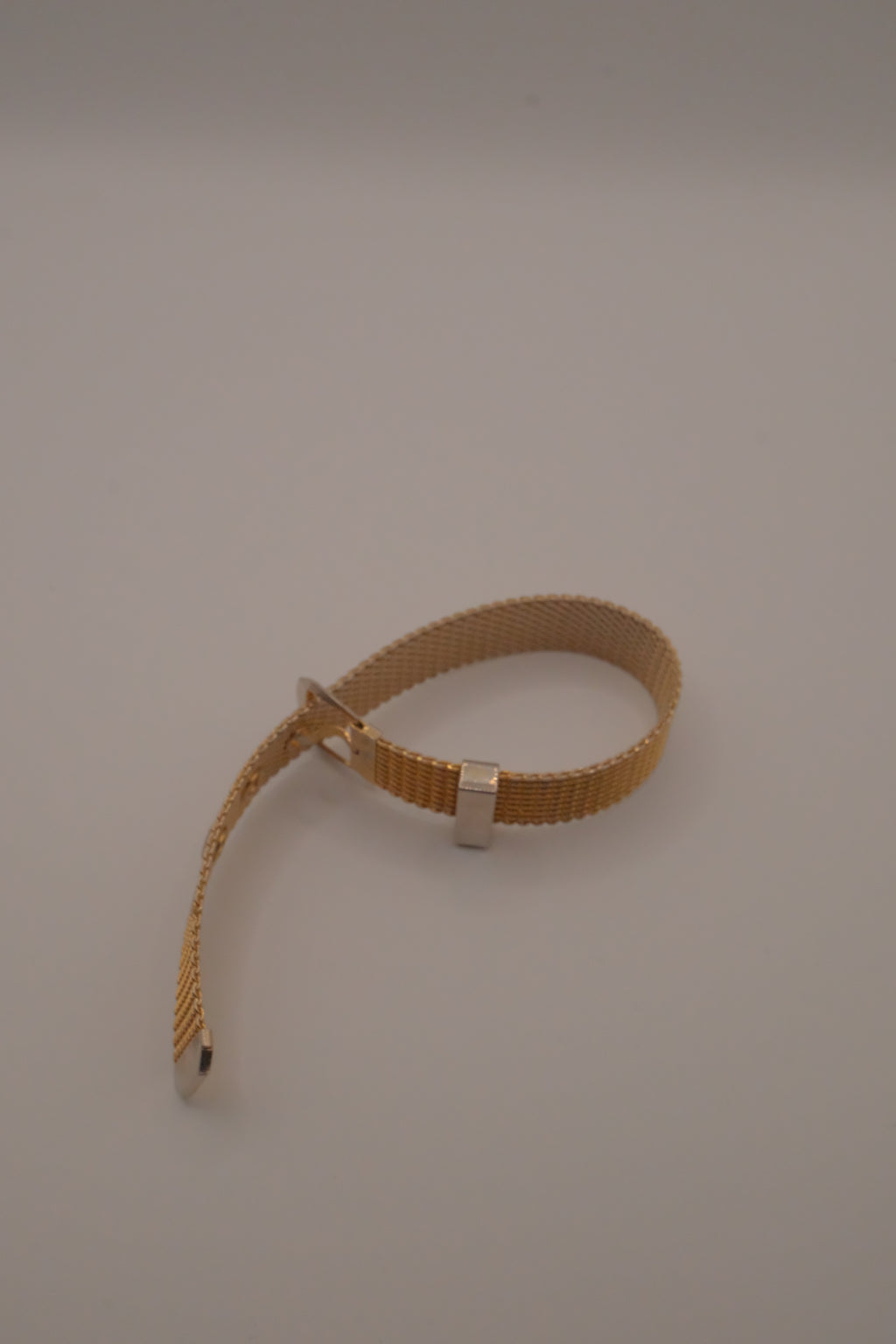 Vintage 1970s Avon gold-tone mesh belt buckle bracelet