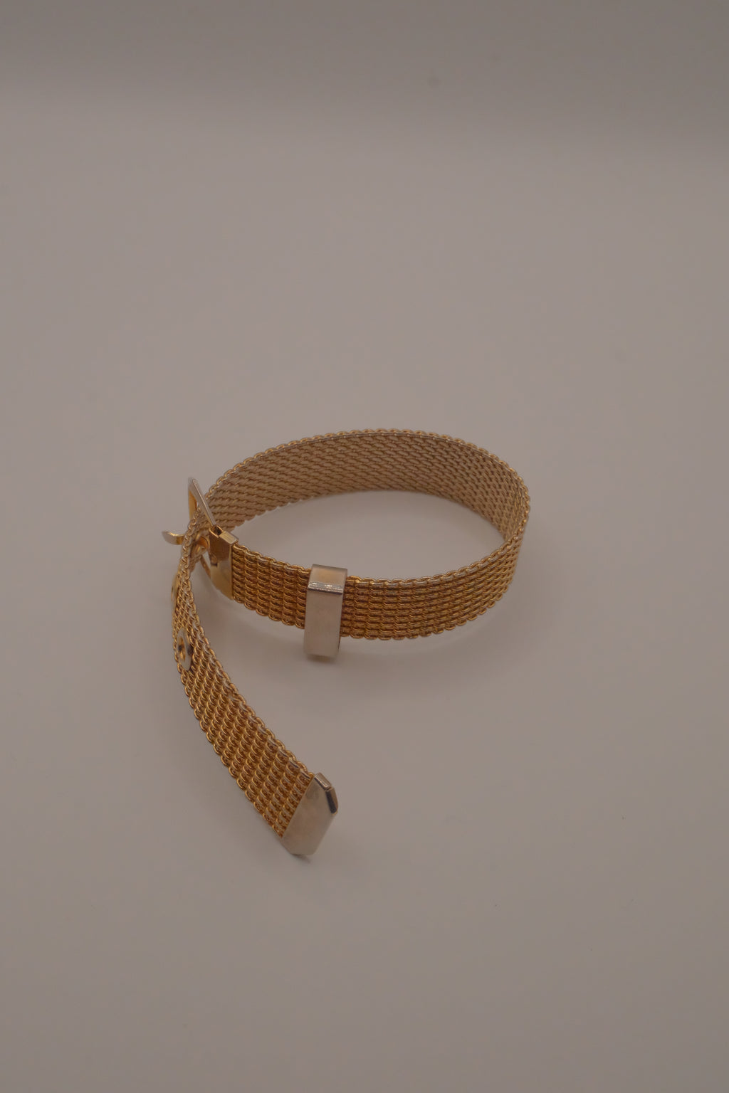 Vintage 1970s Avon gold-tone mesh belt buckle bracelet