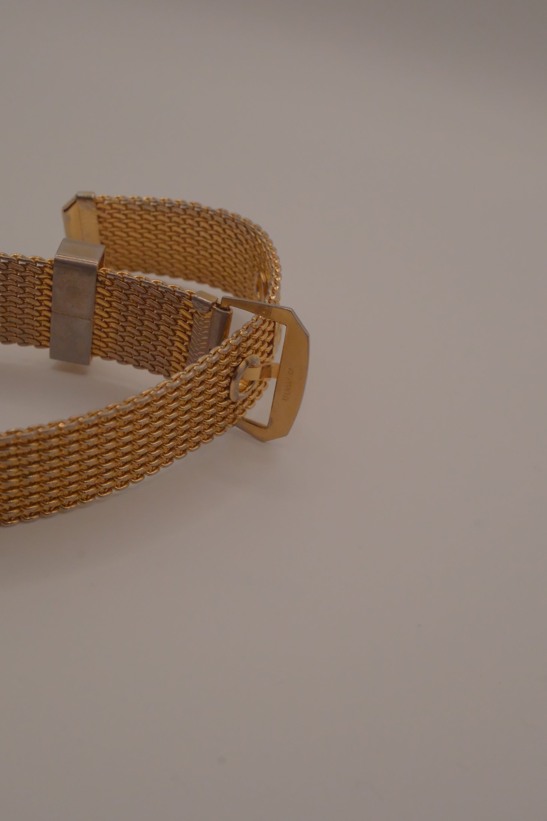Vintage 1970s Avon gold-tone mesh belt buckle bracelet
